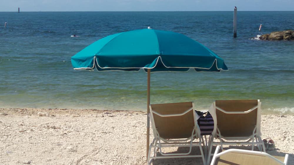Light blue umbrella on beach
