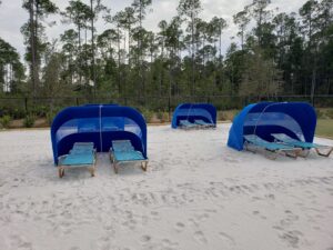 blue cabanas on sand