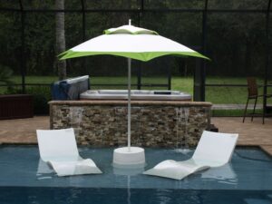 green catalina in pool with shelf loungers and table