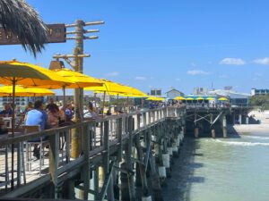 Side view of yellow umbrellas on pier